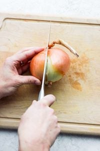 Cutting into onion
