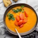 Carrot ginger soup served with crusty bread