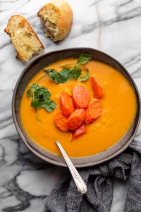 Carrot ginger soup served with crusty bread