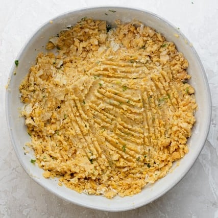 Ingredients for chickpea fritters in a bowl after combining.