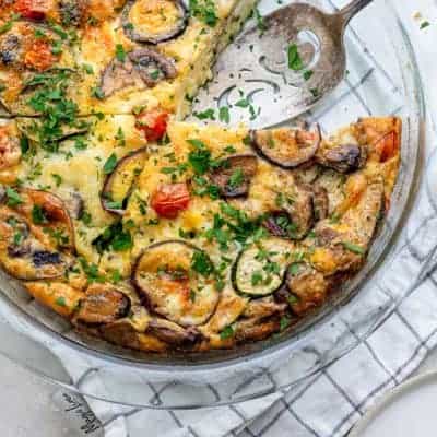 top down shot of crustless quiche with slice taken out