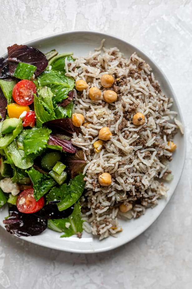 Ground beef and rice served with a side salad