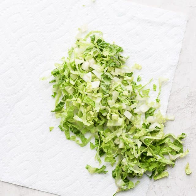 chopped lettuce on a paper towel