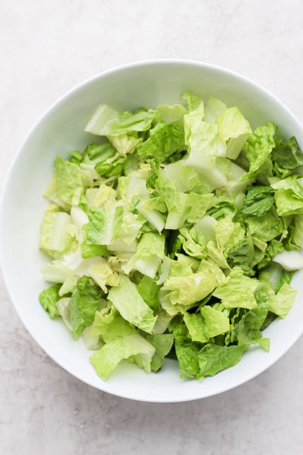 overhead shot of chopped lettuce in a bowl