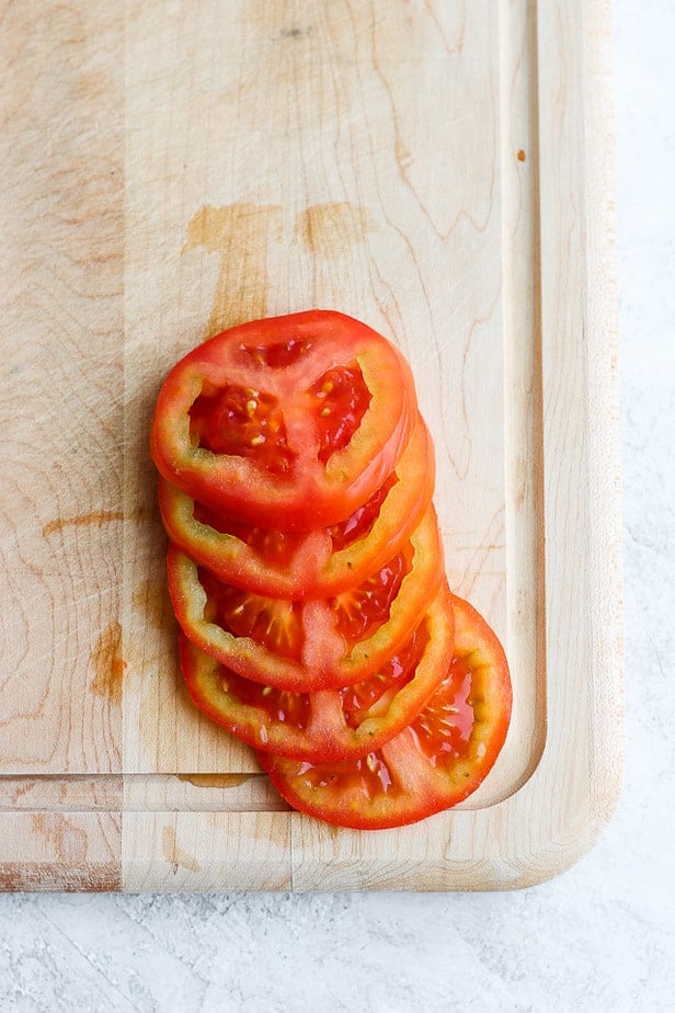 Pretty sliced tomatoes on a cutting board