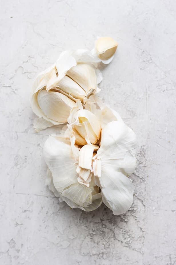overhead shot of a crushed bulb of garlic