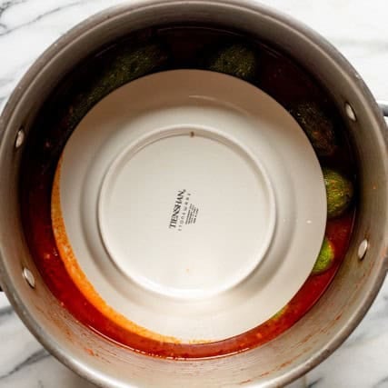 Plate placed on top of pot.