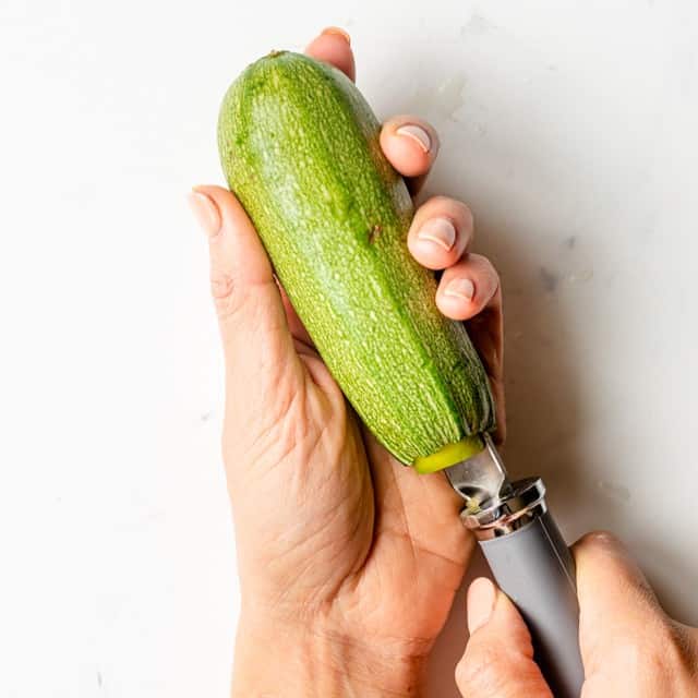 Tool inserted into squash to remove inside.