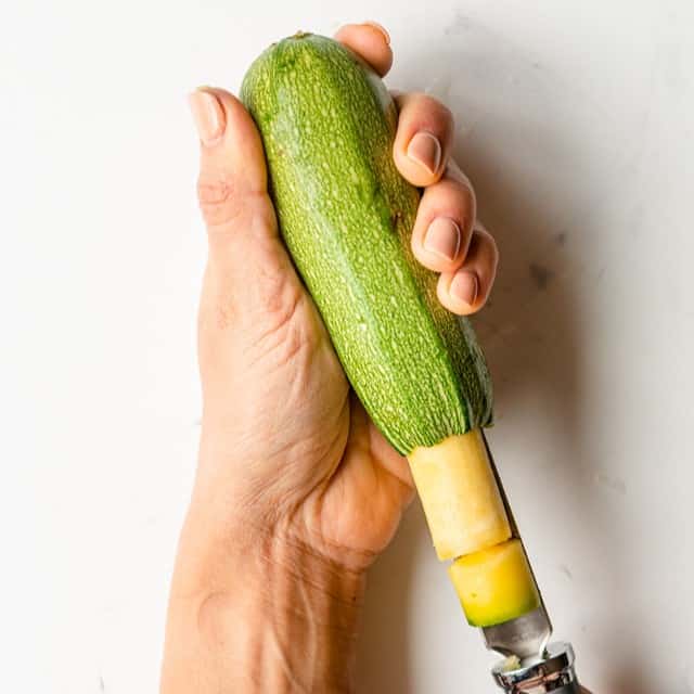 Removing core of squash.