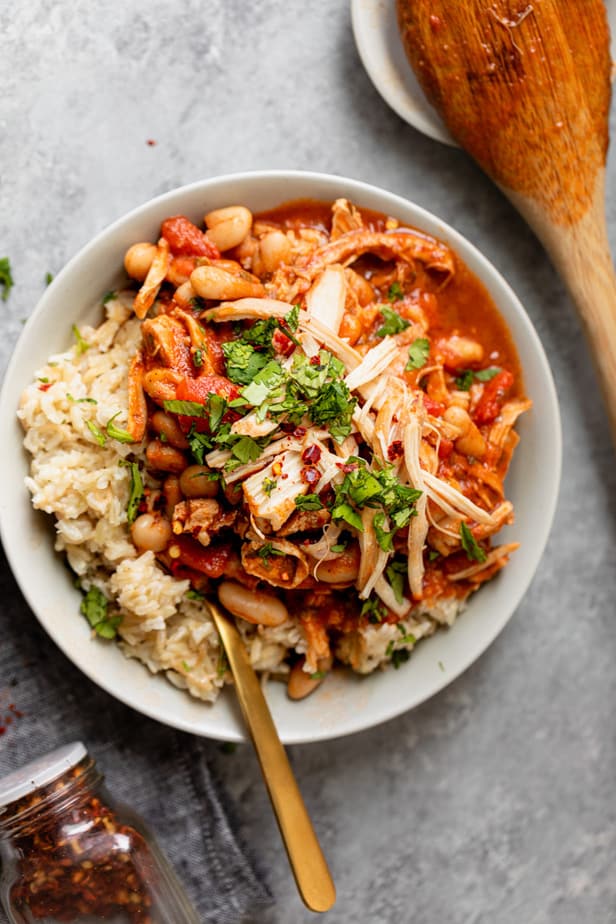 Lebanese bean stew served in a white bowl with rice