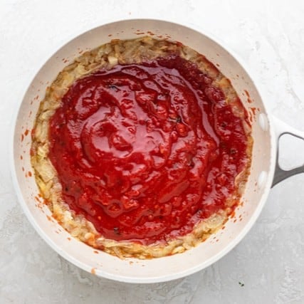 Crushed tomatoes added.