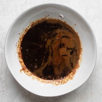 Ingredients to make whipped coffee in a bowl after mixing.