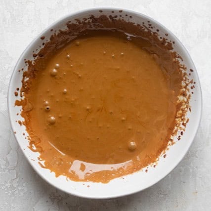 Whipped coffee showing lighter color and thicker consistency.