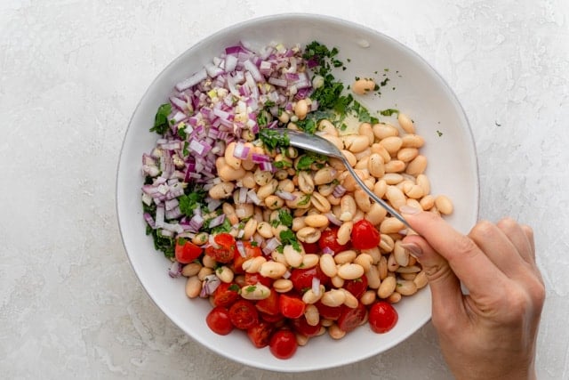 The ingredients being mixed together in a bowl