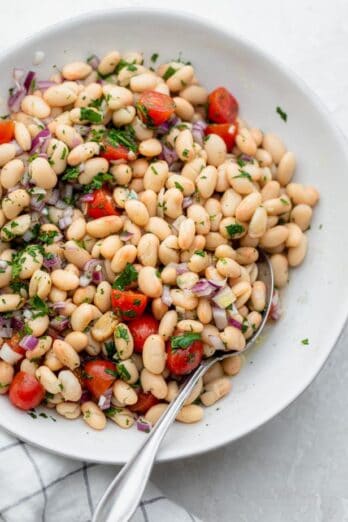 White bean salad in a white bowl