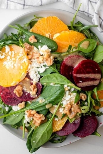 Beet orange salad assembled in a serving bowl.