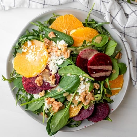 Beet orange salad assembled in a serving bowl.
