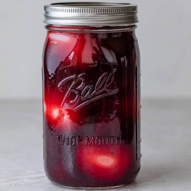 A jar of beet pickled eggs.