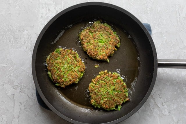 Fritters on a pan getting fried