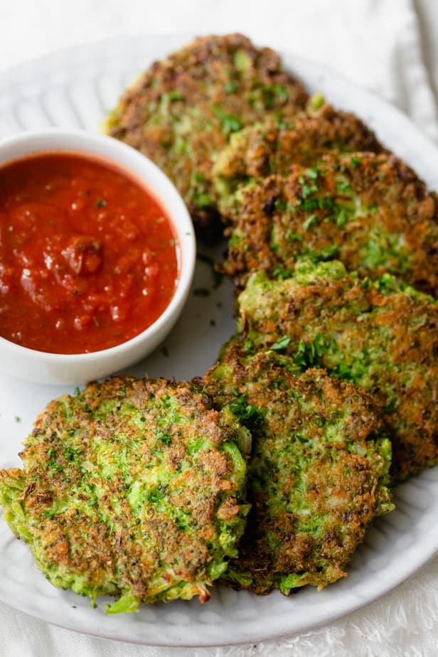 Close up shot of the broccoli fritters served with marinara sauce