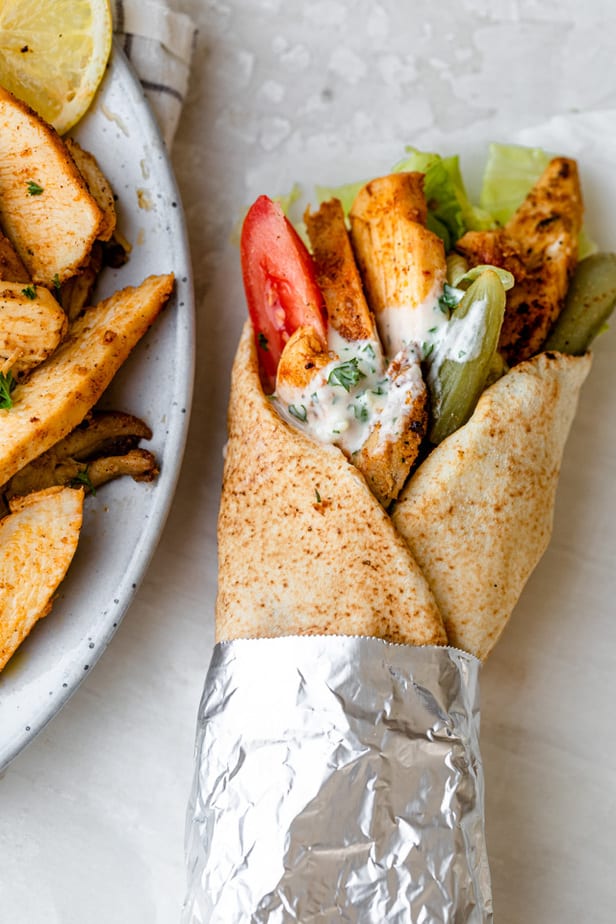 Chicken shawarma wrap with vegetables and sauce