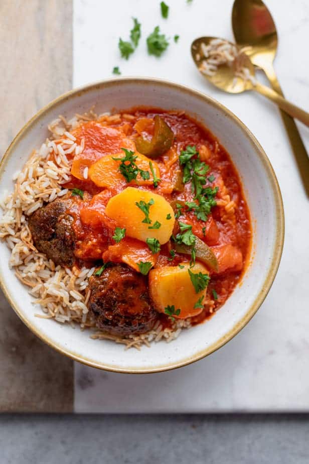 kafta and potato stew served in a bowl with rice