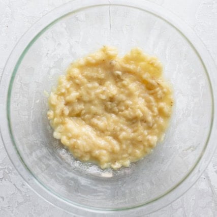 Mashed bananas in a bowl.