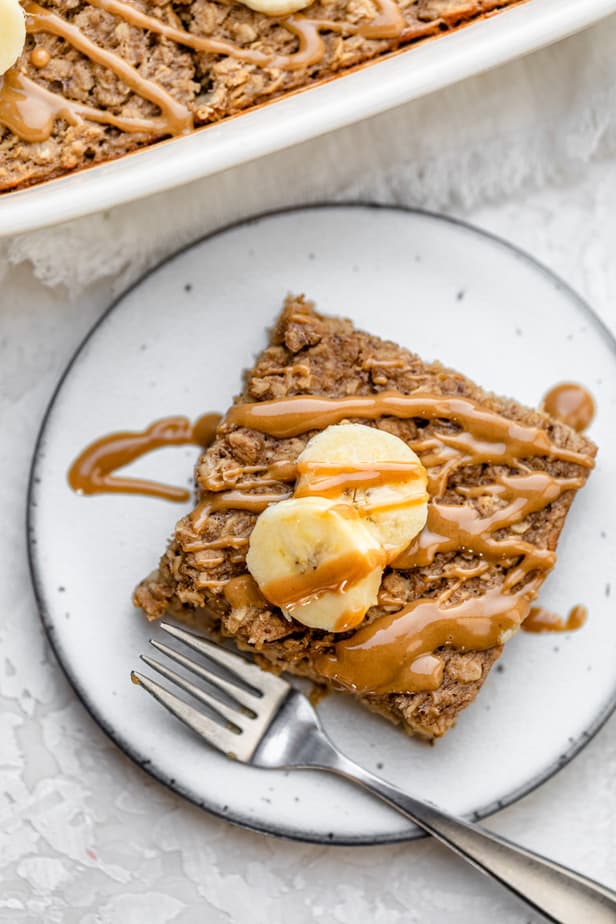 A square of Peanut Butter Banana Baked Oatmeal served on a white plate