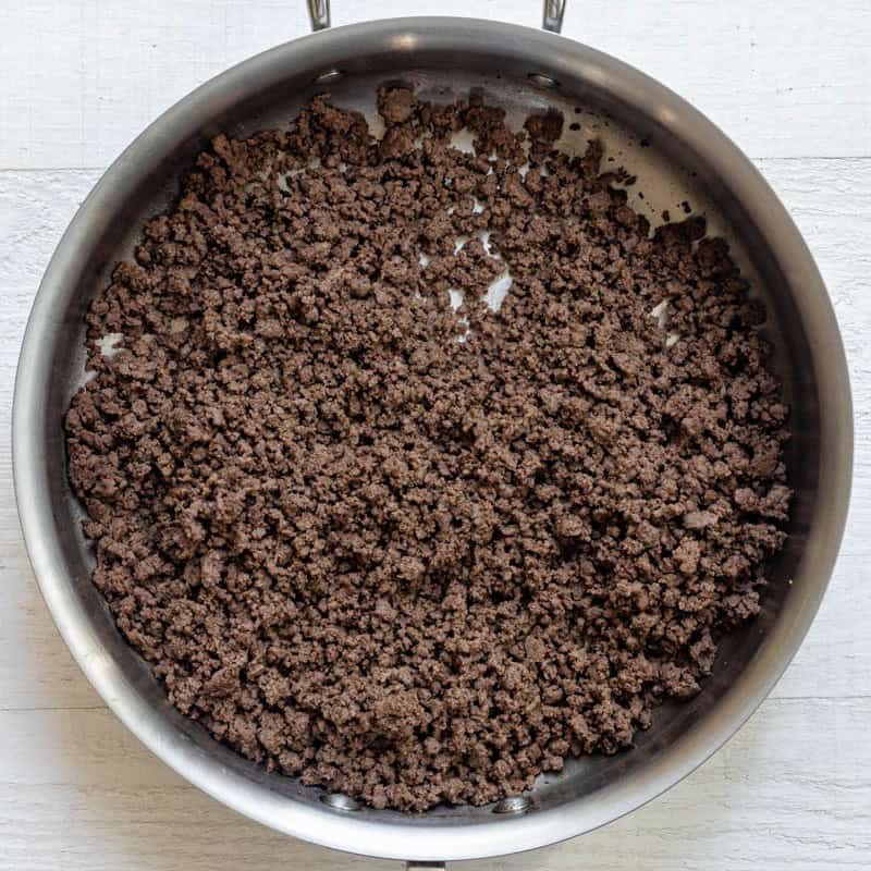 Seasoned ground beef in pan.