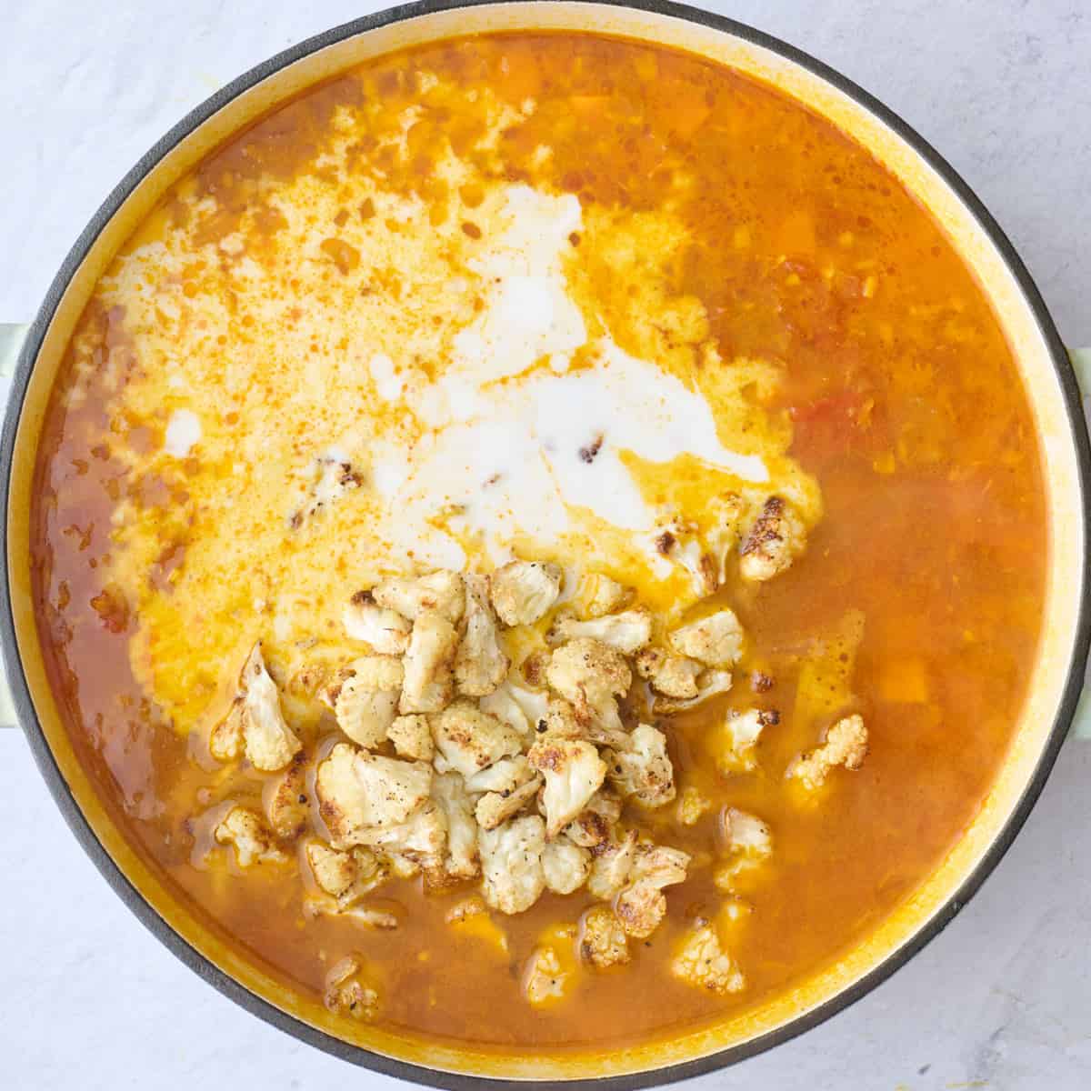 The soup after cooking with coconut milk and most of the roasted cauliflower added.