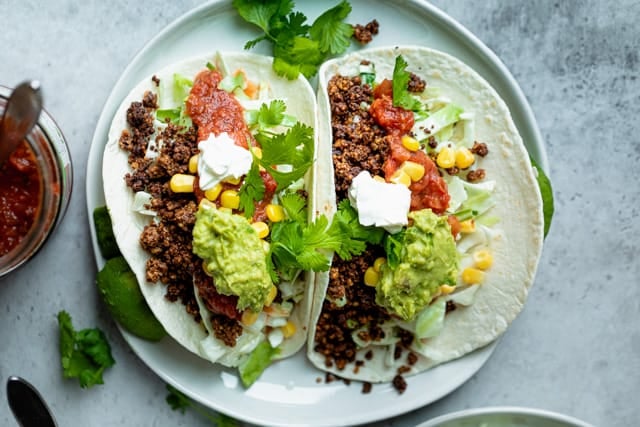 Tacos stuffed with the walnut mixture and toppings