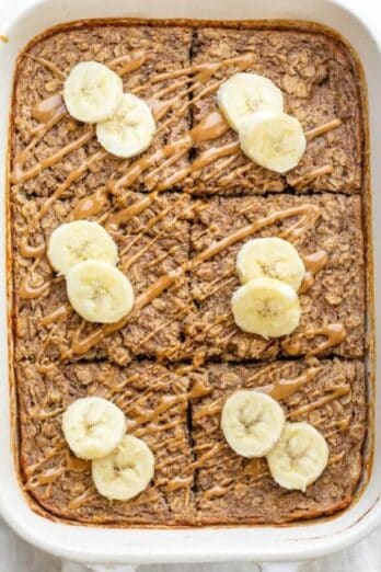 Banana baked oatmeal drizzled with peanut butter and top with banana slices