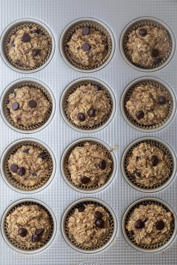 Banana oatmeal cup mixture in a muffin tin after baking.