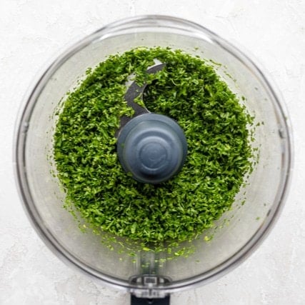 Pulsed parsley in processor.