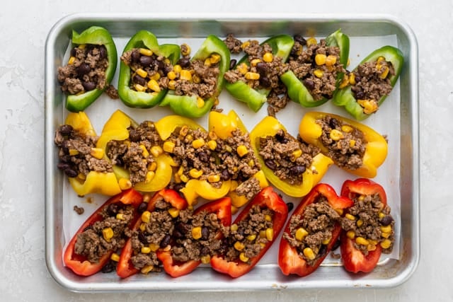 The filling on top of the bell peppers