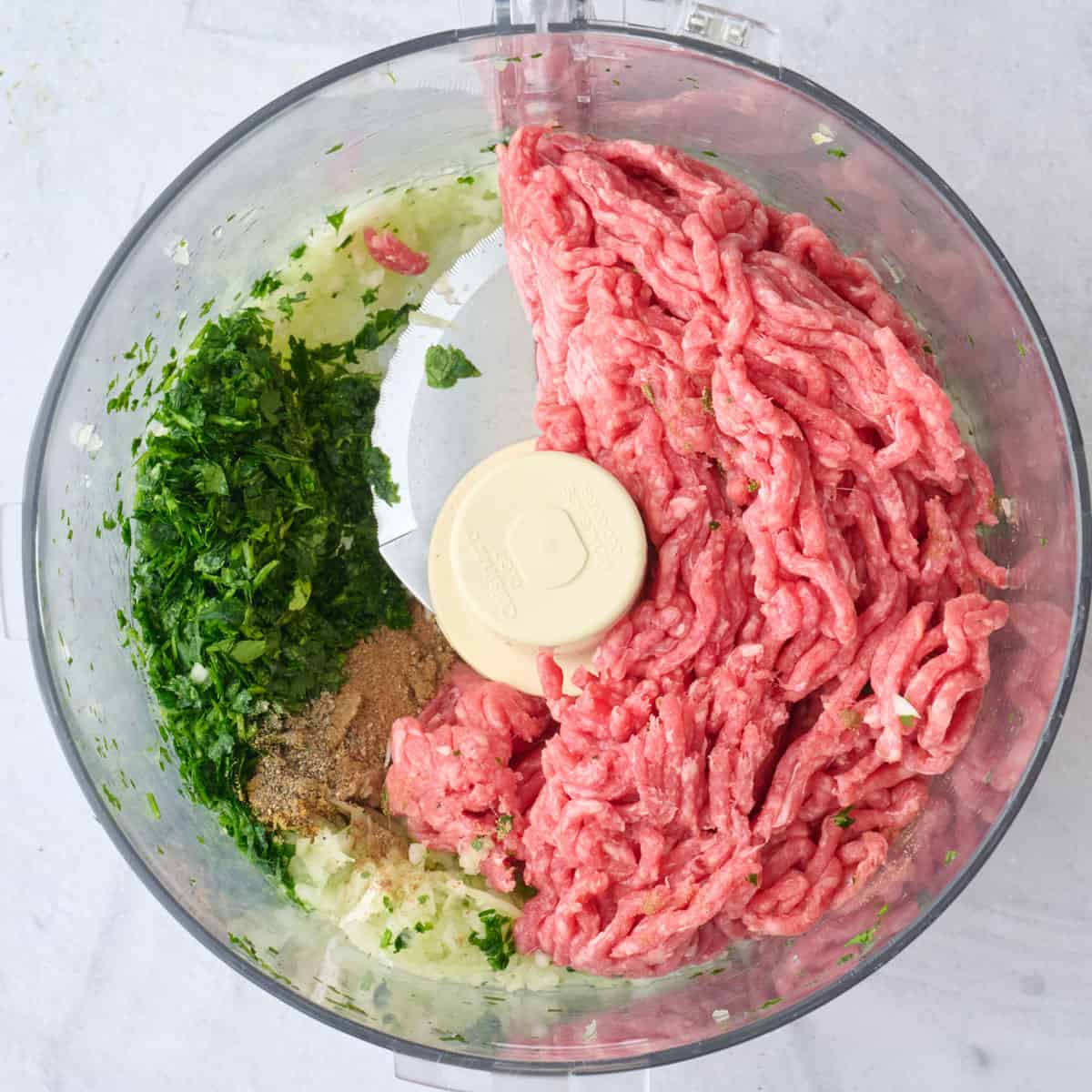 Onion after finely chopped with chopped parsley and ground beef added.