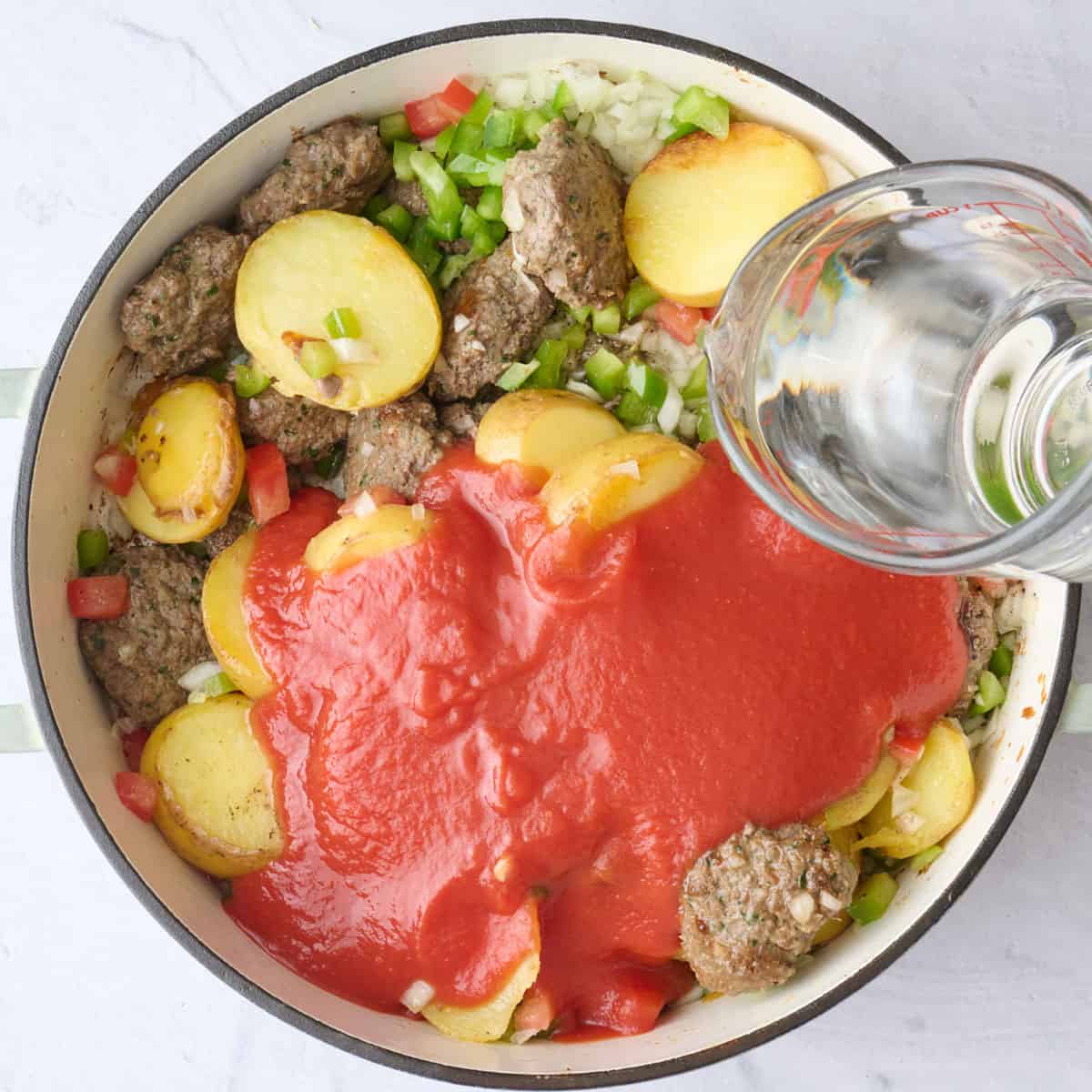 Tomato sauce, water, salt and pepper added.