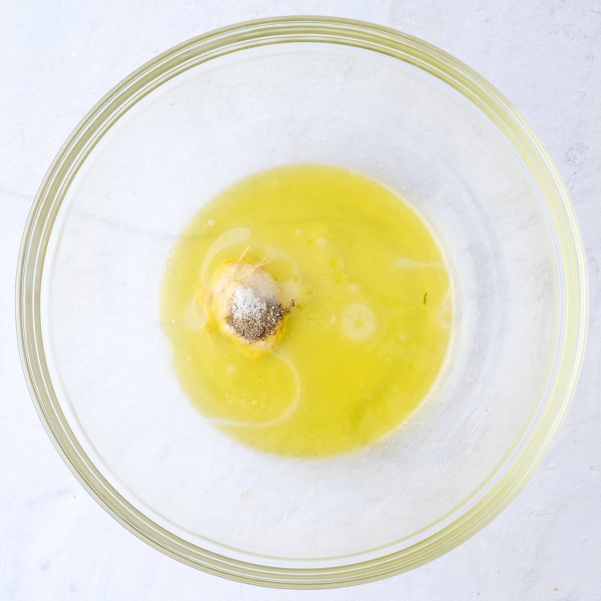 Lemon juice, oil, mustard, salt and pepper in a large bowl before combining.