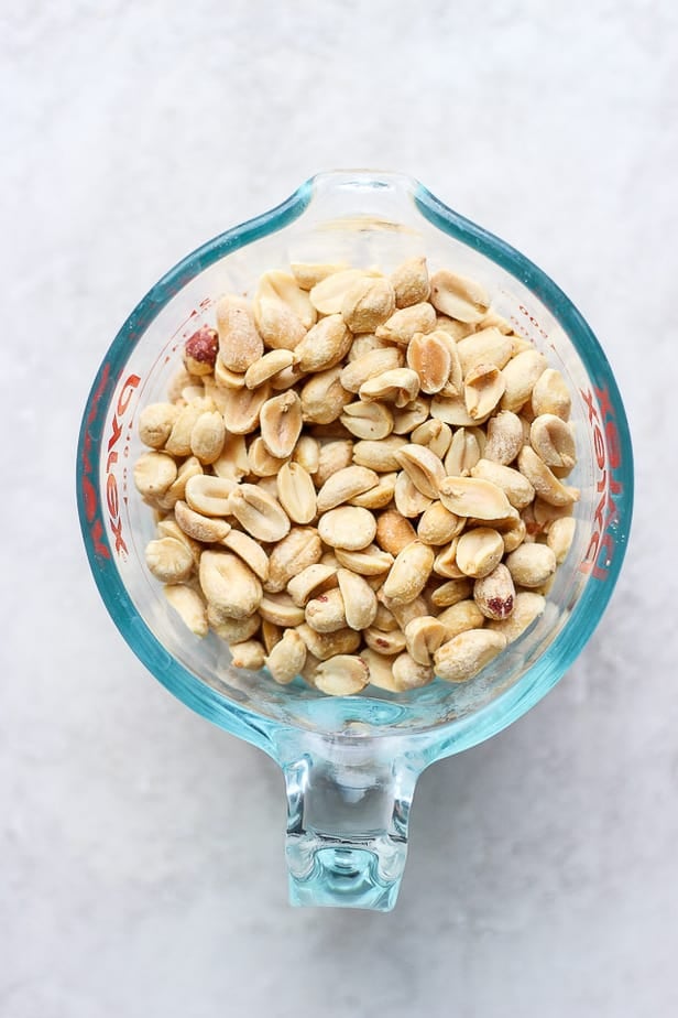 overhead shot of peanuts in a pyrex jug