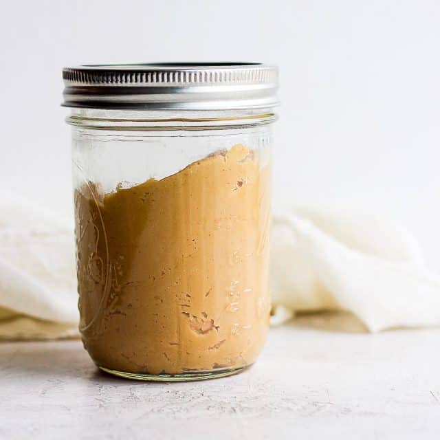 peanut butter in a jar with a lid on 