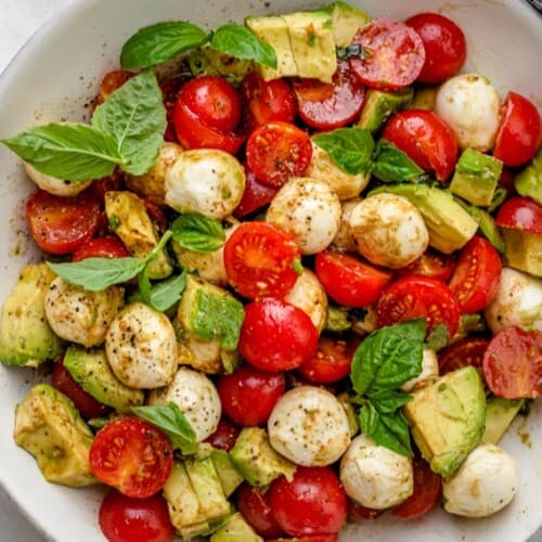 Avocado Caprese salad in a bowl.