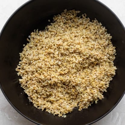 Freekeh added to the onions.