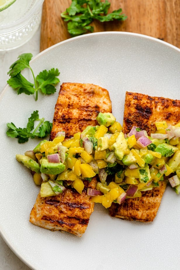 Cooked mahi mahi fillets topped with mango avocado salsa