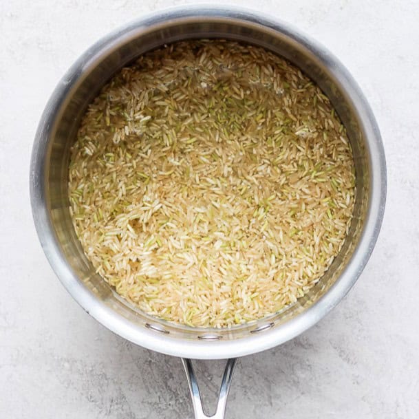 Water added to the pot of rice.