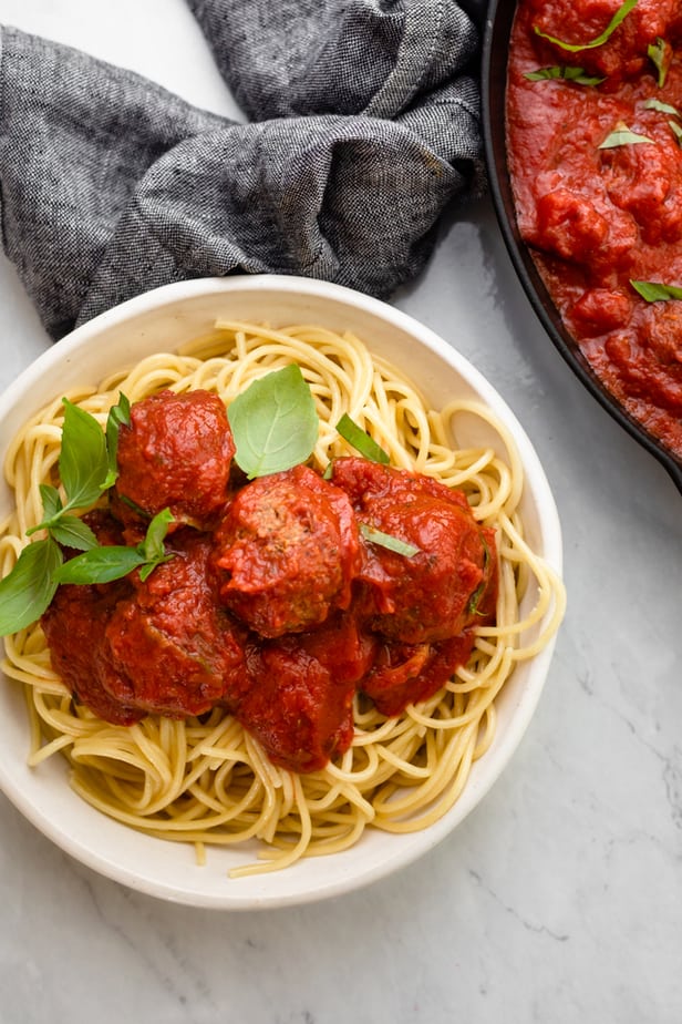 Final vegan meatballs with marinara sauce over spaghetti