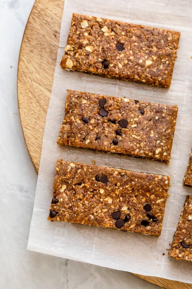 Close up shot of three vegan protein bars on parchment paper