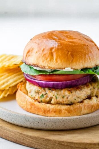 Ground chicken burger served with potato chips