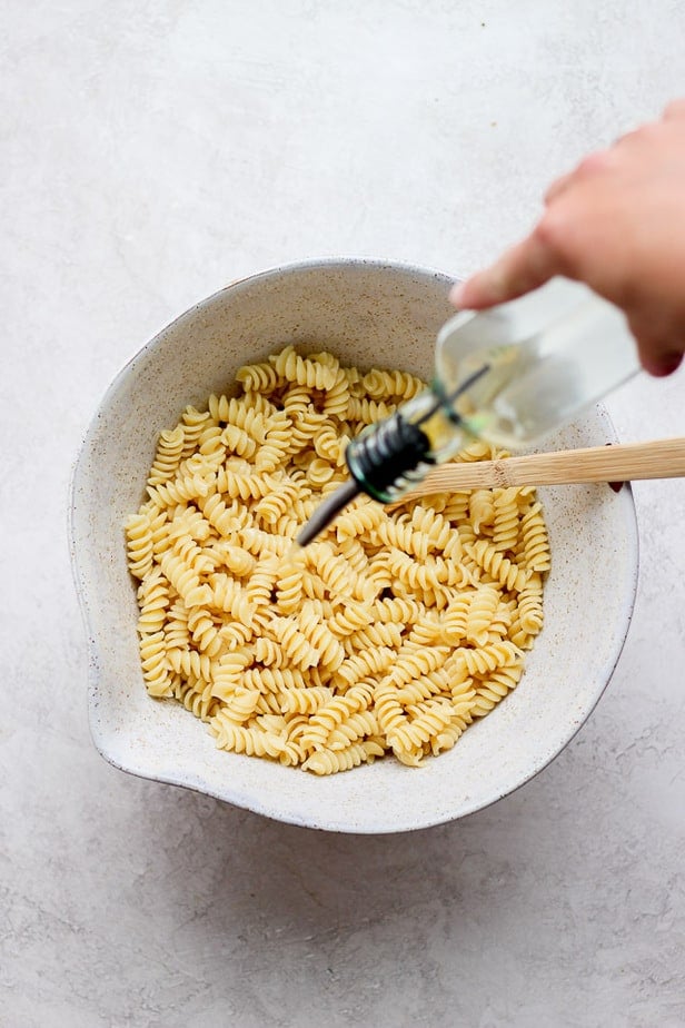 bowl of cooked pasta with oil poured on it