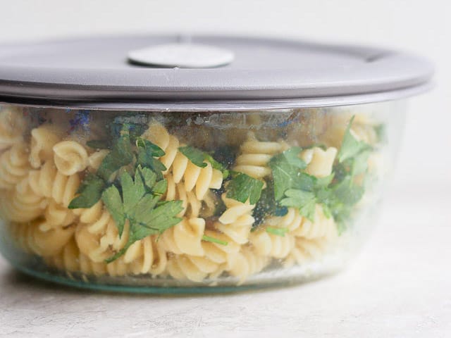 bowl of cooked pasta with oil poured on it