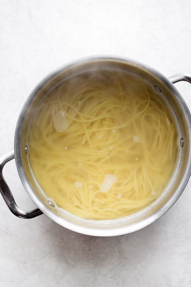 cooking pasta in a pot with water